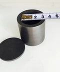 Top Shelf Graphite Crucible With Secure Lid For Heavy Duty Lab Smelting And Quick Melting Projects Four Inch Square showing measurement tape.