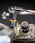 Fifteen Piece One Quarter Inch And Three Eighth Inch Drive Bolt Biter Impact Extraction Socket Set for damaged fasteners in use on a bolt