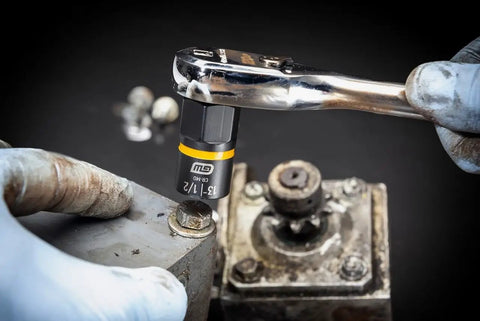Fifteen Piece One Quarter Inch And Three Eighth Inch Drive Bolt Biter Impact Extraction Socket Set for damaged fasteners in use on a bolt