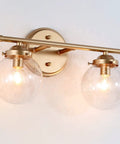 Two Light Gold Vanity Lighting Fixture With Globe Seeded Glass Shades For Bathroom Slick Modern Dark Gold Finish 14 Inches Long
