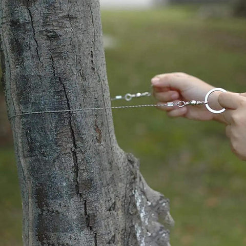 Beefy Stainless Steel Portable Wire Saw For Outdoor Wood Cutting, Survival And Camping Gear in use on tree trunk