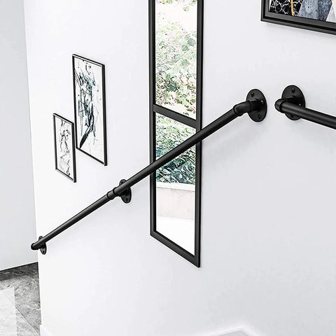 Sleek Black Wrought Iron Stair Rails With Super Grippy Non Slip Coating Zero Hassle Diy Wall Mount Setup Heavy Duty Indoor Outdoor Banister For Seniors Kids Hallway Loft And Bathroom 19 Feet Long mounted on a white wall.