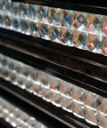 Close-up of crystal diamond mirror glass mosaic tiles showing silver facets for backsplash, kitchen, and bathroom walls.