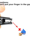 Close-up of a black clip from Stainless Steel Curtain Clips Set 50 Pieces Heavy Duty All Purpose Bulldog Clip Hooks with caution text.