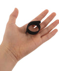 Super Solid 100 Piece Pack Of Self Adhesive Nylon Cable Ties With Cute Round Heads on hand, showing size and flexibility.