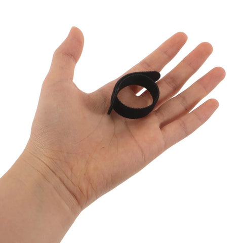 Super Solid 100 Piece Pack Of Self Adhesive Nylon Cable Ties With Cute Round Heads on hand, showing size and flexibility.