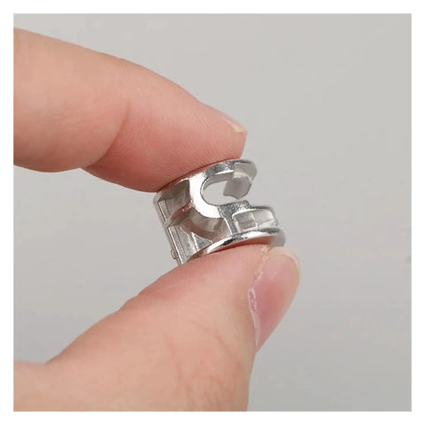 Close-up of Heavy Duty Three In One Connector Eccentric Wheel Hardware held between fingers, nickel plated zinc alloy, silver finish.