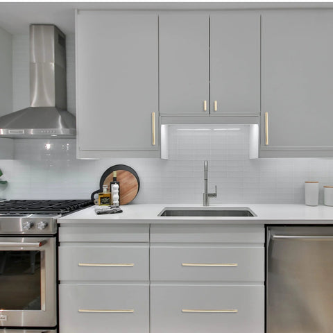 Modern kitchen with 10 Pack 5 Inch Hole Centers Brushed Brass Cabinet Handles Gold Finished Kitchen Cabinet Pulls on gray cabinets.