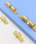 Adjustable Double Ball Cabinet Door Catch Roller Latch for Small Cabinet Doors shown on blue surface