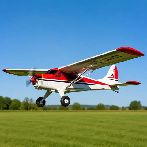 800mm De Havilland Beaver RC Airplane RTF With Gyro 4 Channel 2.4GHz in flight over green field, high visibility red design.