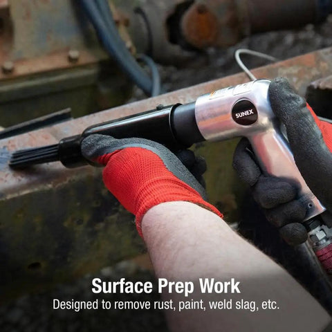 Beast Pistol Grip Needle Scaler With 19 Hardened Steel Needles removing rust from a surface, highlighting use on irregular areas