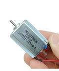 Pro Grade DC Motor With Dual 2mm Shafts And Carbon Brushes Delivering 24000Rpm High Speed Low Noise Operation With Rock Solid Cooling For Any Heavy Duty Weekend Build, held in hand.