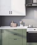 Black Cabinet Pulls 25 Pack, 3 Inch Hole Center, installed on white and green kitchen cabinets