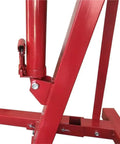 Close-up of Heavy Duty 2 Ton Hydraulic Engine Hoist Folding Shop Cherry Picker Crane 4000lb steel frame and hydraulic ram.
