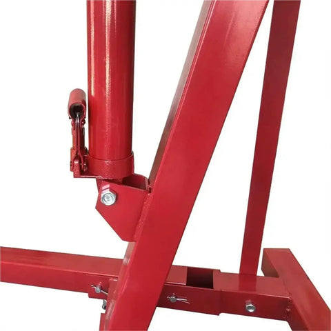 Close-up of Heavy Duty 2 Ton Hydraulic Engine Hoist Folding Shop Cherry Picker Crane 4000lb steel frame and hydraulic ram.