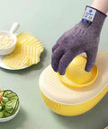 Pro Chef Cut Resistant Kitchen Gloves EN388 Level 5 in violet used for mandolin slicing, displayed with sliced vegetables.