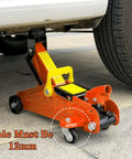 3-ton floor jack with caster wheel set for 12mm stem, orange finish, universal fit, supporting vehicle, exposed wheel details.