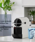 Cleaning Capsule Pods For Nespresso OriginalLine Machines 6 Pack Descaling Pods And Cleaning Solution To Remove Residue And Oils Keep Your Brew Fresh For Real Strong Flavor And Machine Running Smooth, pods beside machine