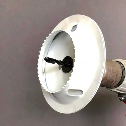 Drywall Repair Kit With Tapered Hole Saw And Two Plugs For Clean Flat Patches showing tapered hole saw attached to drill