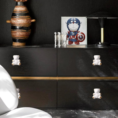 Lovely Teddy Bear Ceramic Cabinet Knobs 2 Pack on black dresser, smooth durable handles for kids room, modern furniture decor.