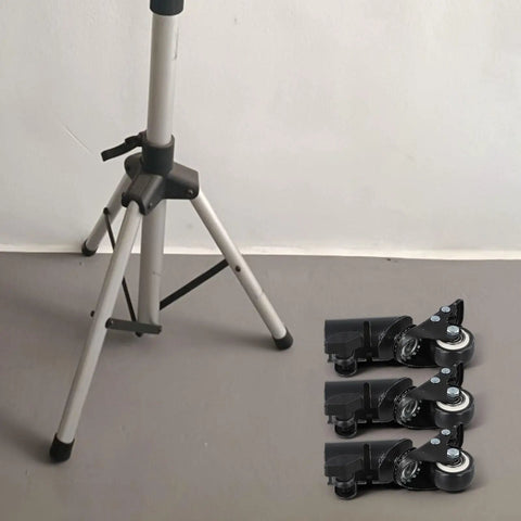 L-Shaped Speaker Tripod Casters with Silent Ball Bearings beside a tripod on a grey floor, showcasing design and installation setup.