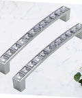 Crystal U Shaped Drawer Pull Handles In Bright Chrome With Screws 2 pack on a marble surface