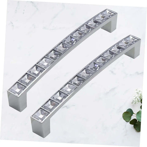 Crystal U Shaped Drawer Pull Handles In Bright Chrome With Screws 2 pack on a marble surface