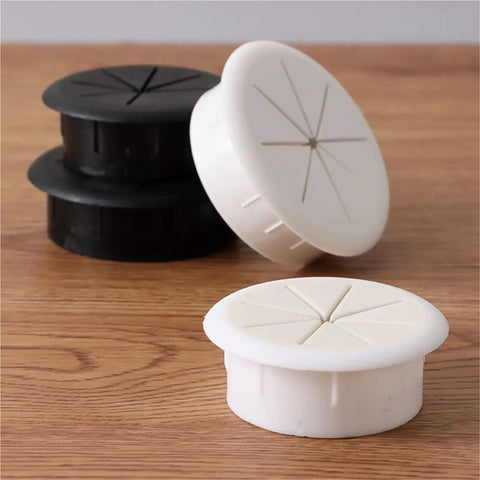 Slick 60Mm Desktop Cable Grommet Kit With 20Pcs Wire Hole Covers To Organize Messy Desk Cords And Keep Your Workarea Super Neat And Totally Stress-Free. 60mm black and white plastic cable grommets on a wood desk