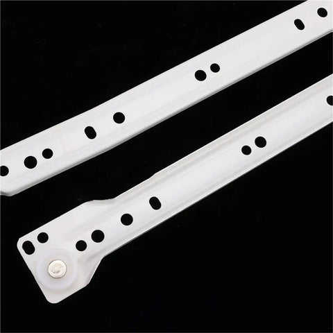 Two white steel rails from Beefy Heavy Duty Keyboard Roller Slides for Cabinets and Desks with Full Extension Ball Bearing Rails.