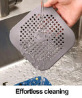 Two Pack Shower Drain Hair Catcher With Strong Suction Cups No Fuss Setup Straight Up Game Changer For Killing Clogs Quick Install Works Awesome On Tubs Kitchen Sinks Lightweight Grey Design in use under running water.