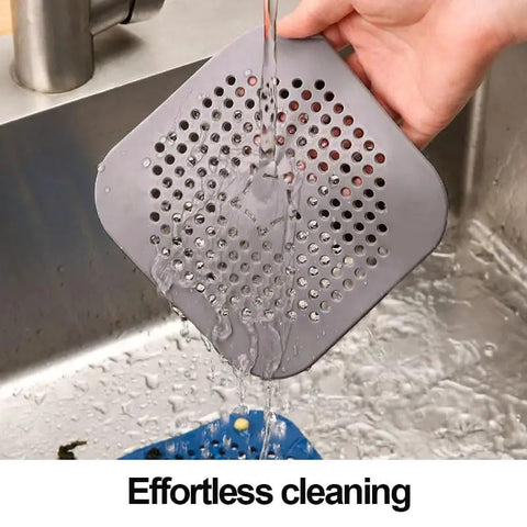 Two Pack Shower Drain Hair Catcher With Strong Suction Cups No Fuss Setup Straight Up Game Changer For Killing Clogs Quick Install Works Awesome On Tubs Kitchen Sinks Lightweight Grey Design in use under running water.