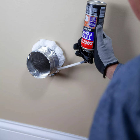 Applying Big Gaps Spray Foam Sealant That Expands To Fill And Insulate Up To Three Inches, 12 Fl Oz Can, around a metal duct opening