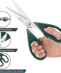 Person holding heavy duty kitchen scissors with stainless steel blades and green comfort grip handles.