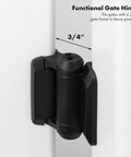 Close-up of black 2-Pack Adjustable Tension Gate Hinges With Caps For Outdoor Wood And Metal Gates installed on a white gate.