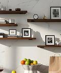10 Inch Black Hidden L Shelf Brackets Set Of 12 Heavy Duty Iron Floating Shelf Brackets supporting wooden shelves with decor in living room.