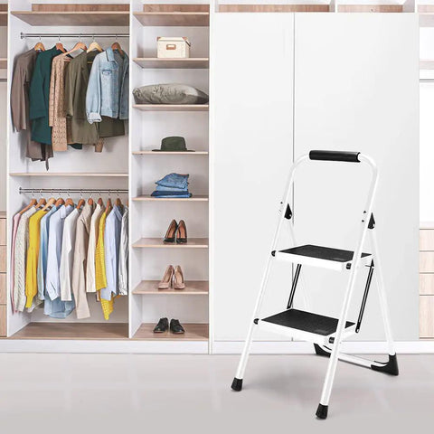 Foldable 2 Step Ladder With Handgrip And Anti Slip Wide Pedals Built Like A Tank For Adults Sturdy Stepladder in front of closet