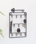 Heavy Duty Iron Wall Coat Rack With Eleven Sick And Sturdy Key And Bag Hooks For Front Door Organization Hat Towel Purse Storage Setup Gonna Keep Your Entryway Looking Totally Fresh on a white wall with keys hanging.
