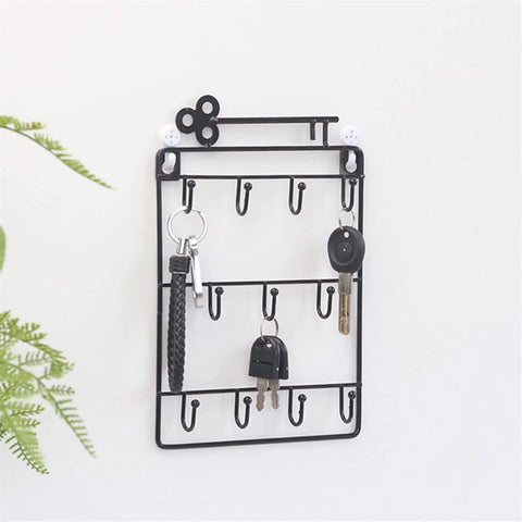 Heavy Duty Iron Wall Coat Rack With Eleven Sick And Sturdy Key And Bag Hooks For Front Door Organization Hat Towel Purse Storage Setup Gonna Keep Your Entryway Looking Totally Fresh on a white wall with keys hanging.
