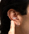 Close-up of a person wearing Flight Ready Earplugs For Ear Pressure Relief On Flights Pain Free Takeoffs And Landings Cut Cabin Noise And The Hum Of Engines Comfortable Fit For Men And Women Essential Air Travel Gear For A Smoother More Chill Flight Experience.