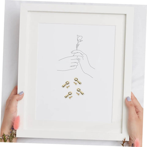 Heavy Duty Iron Picture Frame Backing Clips Featuring Quick Turn Button Fasteners And All Included Mounting Screws For Hanging Wall Photos Artwork Crafts Straight Up No Sweat, shown with a white frame and drawn hands.
