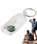 Trail Ready Hiking Compass Keychain Tool For Quick Navigation close-up with hikers, durable outdoor navigator on rock.