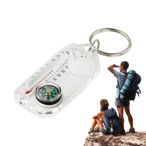 Trail Ready Hiking Compass Keychain Tool For Quick Navigation close-up with hikers, durable outdoor navigator on rock.