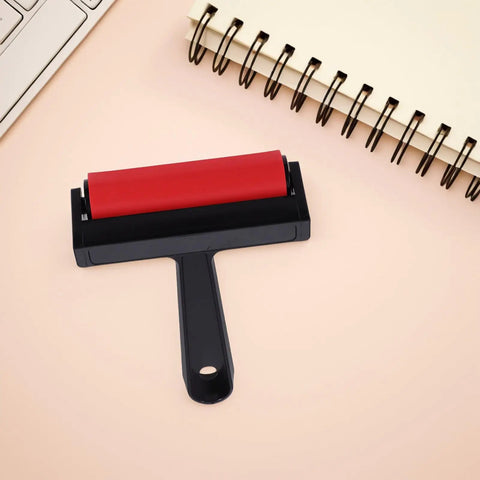 Solid Grip Rubber Paint Roller For Printmaking And Classroom Art Projects featuring a red rubber roller on a minimalistic black handle