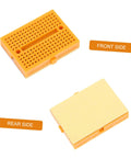 Plug And Play Solderless Breadboard Kit With Six Compact Yellow Protoboard Panels showing front and rear sides of a yellow protoboard.