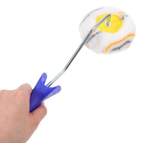 Close-up of a hand holding a double ended paint roller brush tool with soft cover, ideal for tricky corners.