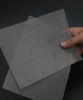 4 Piece Stainless Steel Vehicle Bumper Repair Mesh Kit Silver For Quick Hole Fix On Car Bumpers And Fenders Easy Install Durable Body Patch Solution For DIY Enthusiasts, hand holding 4 silver stainless steel mesh sheets