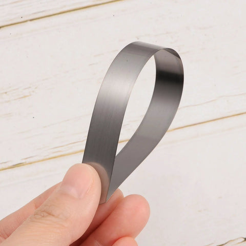 Mn steel feeler gauge blade, 0.2 mm thick, 150 mm long, held between fingers.