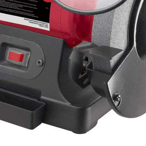 Close-up view of Powerful Eight Inch Bench Grinder Boots Kickin with three quarter horsepower motor and power switch.