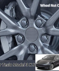 Tesla Wheel Lug Nut Covers Kit For Model 3 Y S X With Dismantle Tool, shown on metallic gray wheel, close-up view.