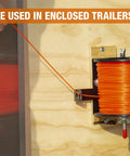 Rock Solid Commercial Trimmer Line Spool Holder Bracket showing orange line spool mounted on wall for hassle-free access.
